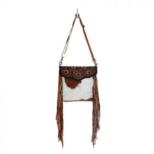 Load image into Gallery viewer, cowhide crossbody purse with tooled leather flap and brown leather fringe