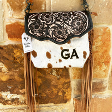 Load image into Gallery viewer, custom branded cowhide crossbody purse with tooled leather flap and brown leather fringe