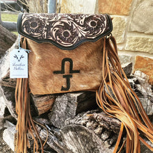 Load image into Gallery viewer, custom branded cowhide crossbody purse with tooled leather flap and brown leather fringe